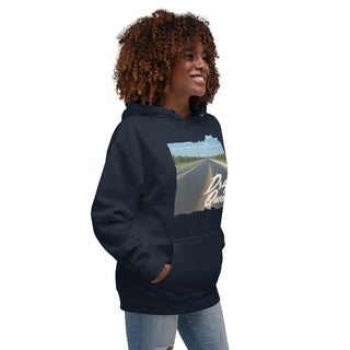 Woman wearing navy Drag Queen hoodie with vintage drag strip print, side angled lifestyle view.