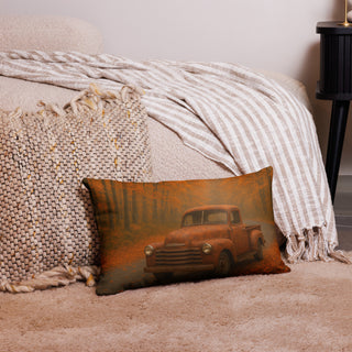 Rustic lumbar pillow featuring a vintage pickup truck parked on an autumn forest road, styled in a cozy home setting with neutral blankets and woven textures.