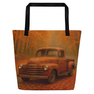 Large tote bag featuring a vintage pickup truck on a winding autumn forest road with warm orange tones, black handles, and a rustic seasonal design.